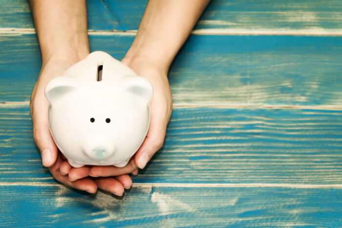 piggybank on blue wood background