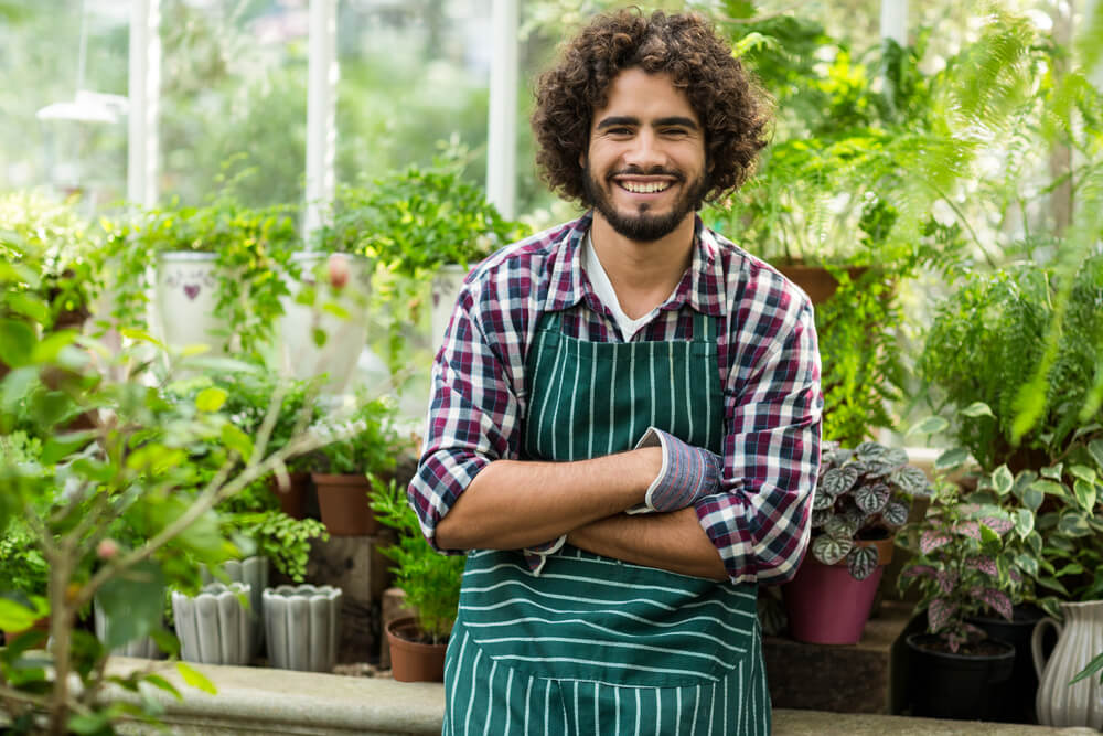 young man in greenhouse